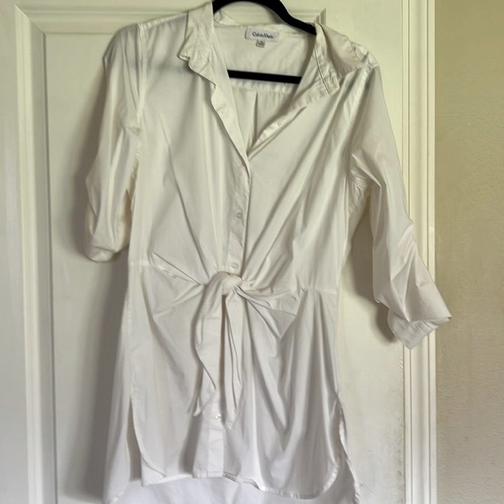 White Calvin Klein dress shirt with tight clothes detail